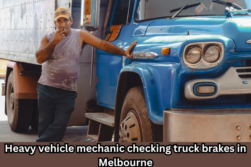 heavy vehicle mechanic checking truck brakes in Melbourne